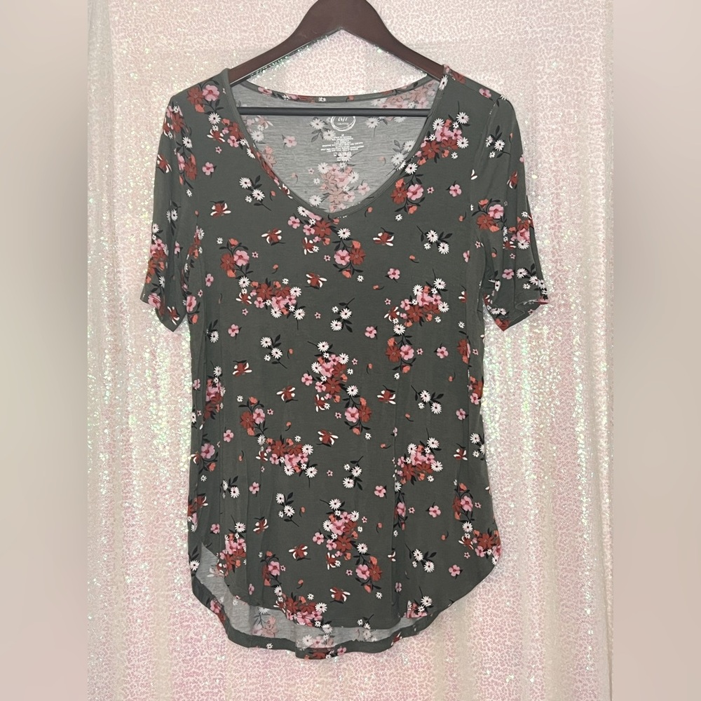 Green and floral top.